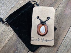 hand-carved avocado stone necklace with quartz stone