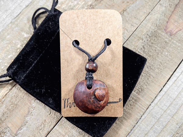 hand-carved avocado stone necklace with heart