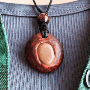 hand-carved avocado stone necklace with tumbled river stone
