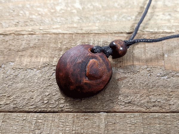 hand-carved avocado stone necklace with heart