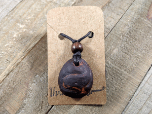 Hand-Carved Avocado Stone Necklace With Whale