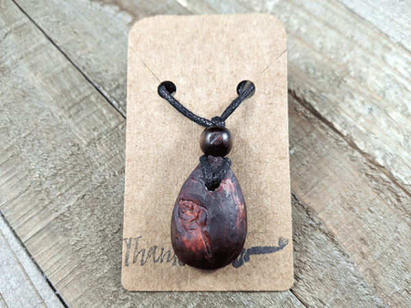 hand-carved avocado stone necklace with leaf design