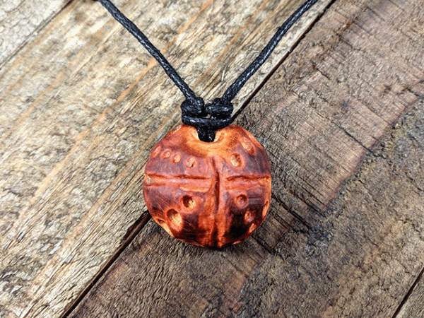 hand-carved avocado stone necklace with dots pattern