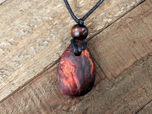 hand-carved avocado stone necklace with leaf pattern