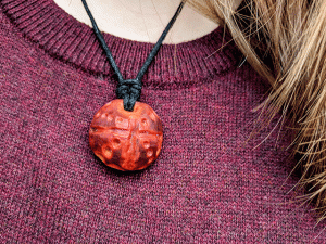 hand-carved avocado stone necklace with dots pattern