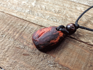 hand-carved avocado stone necklace with leaf pattern