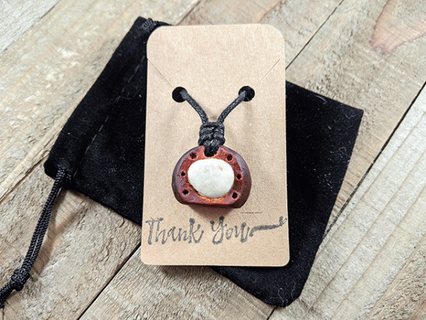 hand-carved avocado stone necklace with white tumbled river stone