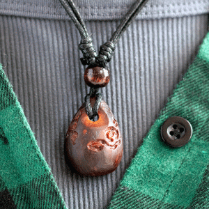 hand-carved avocado stone necklace with rose design