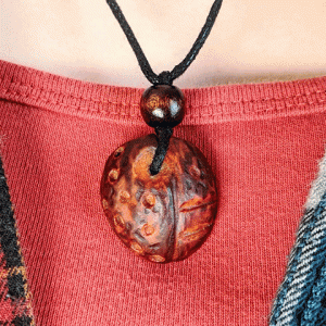 hand-carved avocado stone necklace with tribal pattern