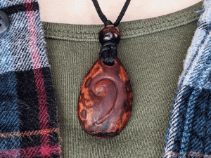 hand-carved avocado stone necklace with bass clef