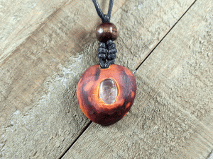 hand-carved avocado stone necklace with clear quartz