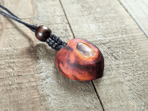 hand-carved avocado stone necklace with clear quartz