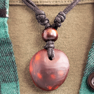 hand-carved avocado stone necklace with natural spots