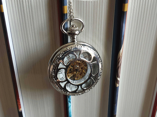 pocketwatch on books photo by jennibeemine. stuck in a time loop.