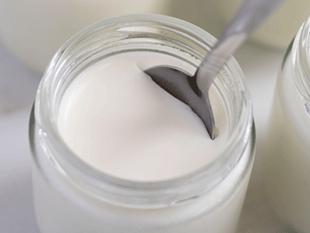 Eurocuisine yogurt in a jar with a spoon