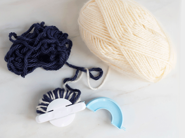 how to loom knit a tiny hearts beanie - close pom pom side