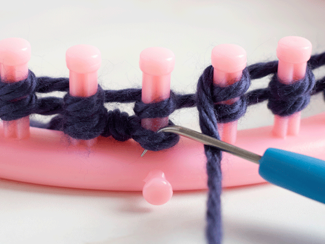 how to loom knit a tiny hearts beanie - insert knitting hook